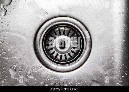 Stainless steel sink with drain, top view, flat lay. Stock Photo