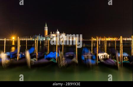 Moored gondolas in the San Marco basin, San giorgio island,Venice,Veneto,Italy, Europe Stock Photo