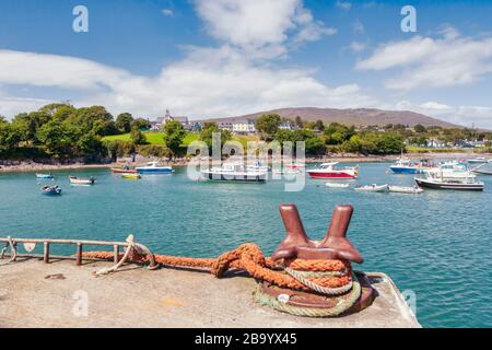 Schull, County Cork, Republic of Ireland.  Eire.  The harbour with the town and St. Mary’s church in the background. Stock Photo