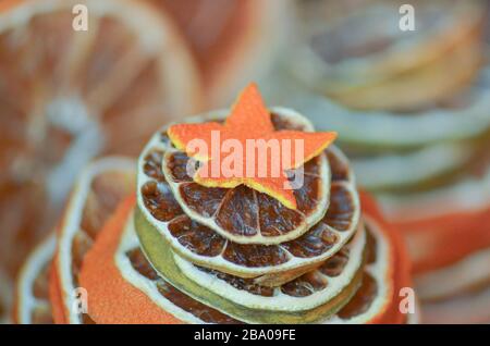 Dried fruits tangerines, oranges and limes. Dried lime, oranges on a metal oven. Natural decor on metal background. Stock Photo