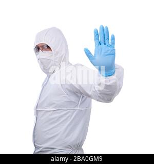 male epidemiologist in coverall disposable anti-epidemic antibacterial isolation suit shows prohibitory gesture with one hand isolated on white backgr Stock Photo