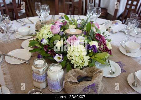 wedding table decorations - flowers on tables at wedding reception on wedding day in England Stock Photo