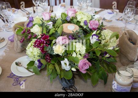 wedding table decorations - flowers on tables at wedding reception on wedding day in England Stock Photo