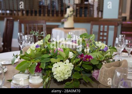 wedding table decorations - flowers on tables at wedding reception on wedding day in England Stock Photo