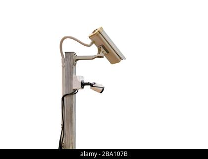 CCTV cameras security surveillance two system setting on wooden pole. isolated on background Stock Photo