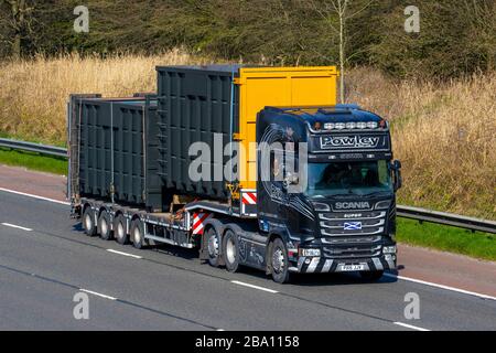 Thomas Powley & Son Ltd; Haulage delivery trucks, lorry, transportation, truck, cargo carrier, Scania Super R 580 vehicle, European commercial transport, industry, M6 at Manchester, UK Stock Photo