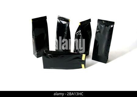 Black Foil plastic paper bag front and back view isolated on white background Stock Photo