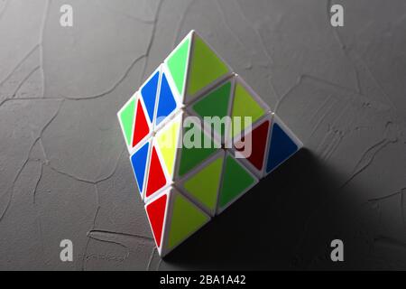 puzzle pyramid on concrete background soft focus Stock Photo