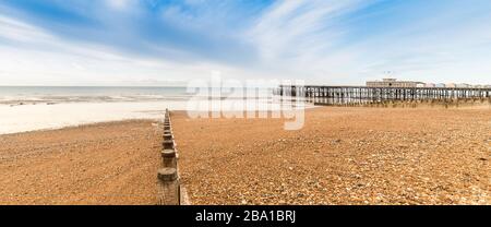 Shore with pier in Hastings, East Sussex, UK. Stock Photo