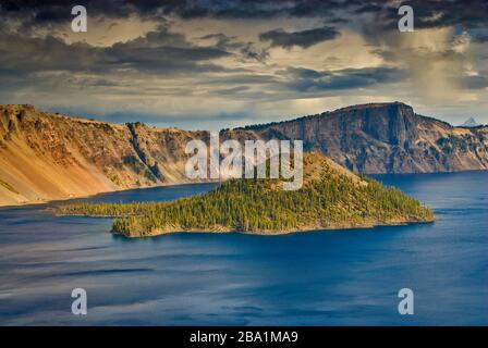 Wizard Island at Crater Lake seen from Rim Village area at Crater Lake National Park, Oregon, USA Stock Photo