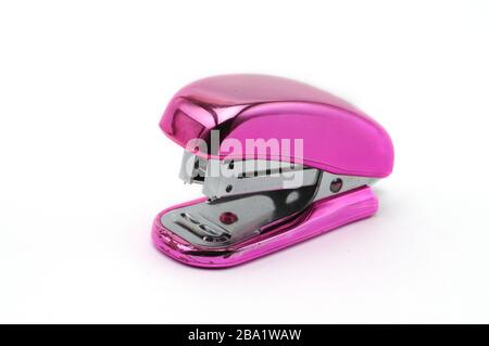 Pink office stapler on an isolated white background Stock Photo