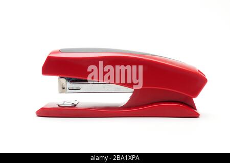 Red office stapler on an isolated white background Stock Photo