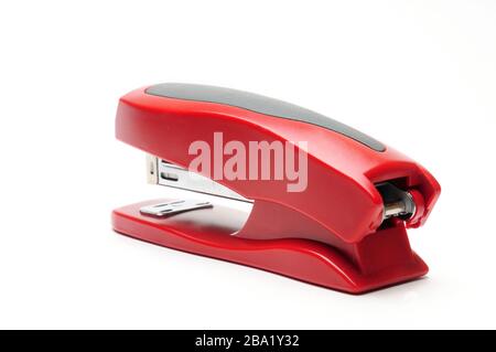 Red office stapler on an isolated white background Stock Photo