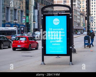 Chicago, Illinois, USA. 24th March 2020. An electronic sign urges people to wash their hands during the COVID-19 pandemic. Stock Photo