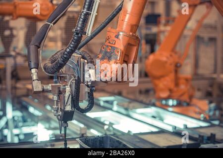 robotic arm for automated production of components for the automotive industry Stock Photo