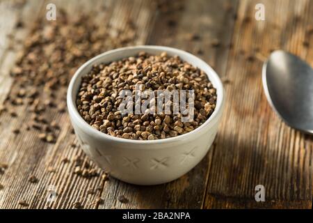 Raw Organic Brown Cardamom Seeds in a Bowl Stock Photo