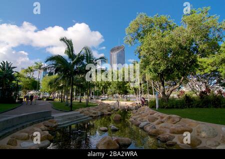 Brisbane, Queensland, Australia - 28th January 2020 : View of 1 William Street Tower building seen from South Bank parkland on a sunny day with some t Stock Photo