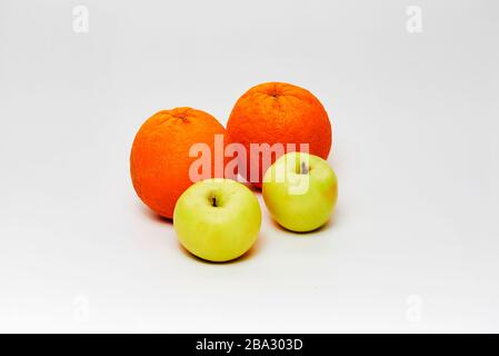 still life of oranges and apples on white background Stock Photo