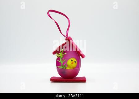 Easter chicks in houses made of colorful eggs Stock Photo