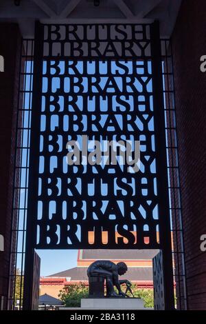 London, England - October 18 2019: Main entrance to the British Library, Euston Road, London, with a statue of Sir Isaac Newton in the background