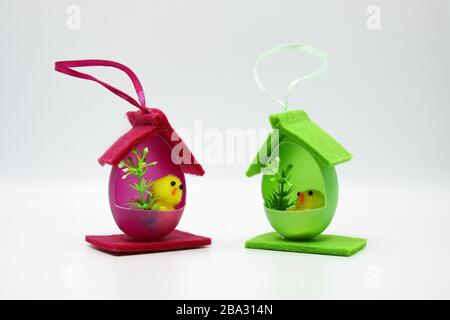 Easter chicks in houses made of colorful eggs Stock Photo
