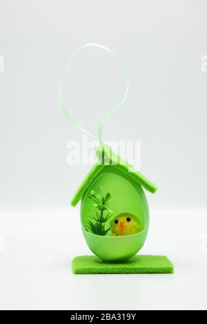 Easter chicks in houses made of colorful eggs Stock Photo