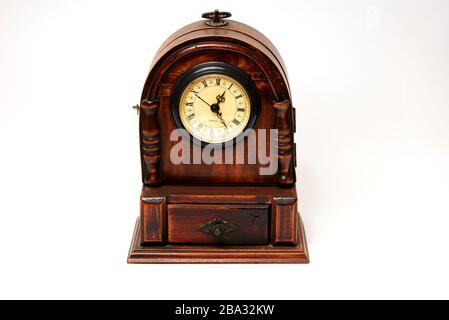 beautiful old wooden clock on white background marking the hours Stock Photo