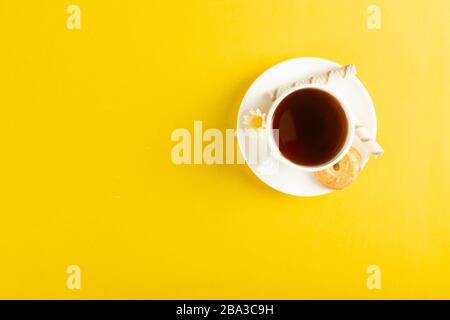 A cup of tea isolated on yellow background Stock Photo