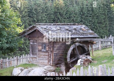 Ancient water mill on the Alps in Italy Stock Photo