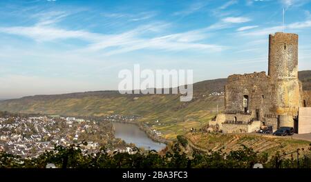 The view of the Landshut castle ruins of BrenKastel-Kues on the Middle Moselle river with its surround ing hillside vineyards. Stock Photo