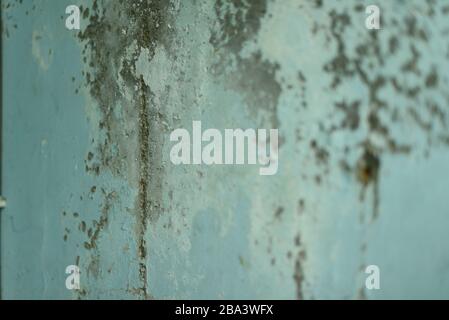 old wall cracked. Blue cracked wall. The texture for designers is an old wall in daylight. Stock Photo