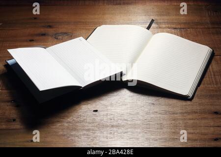 Notebooks on Wooden Background Stock Photo