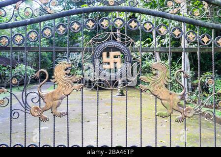 Balinese temple gate with Swastica and two lions Stock Photo