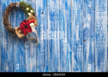 Easter decorative wreath on a light blue wooden surface Stock Photo
