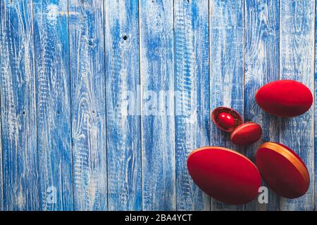 Easter red decorative eggs on a light blue wooden surface Stock Photo