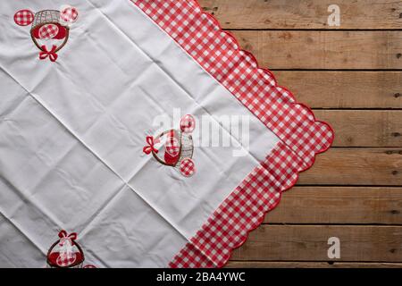 Easter tablecloth on an old rustic wooden table Stock Photo