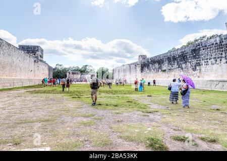 Chichen Itza, Mexico - Dec. 23, 2019: Tourists visit the archaeological site of the Great Ballcourt at Chichen Itza in the Yucatan Peninsula of Mexico Stock Photo