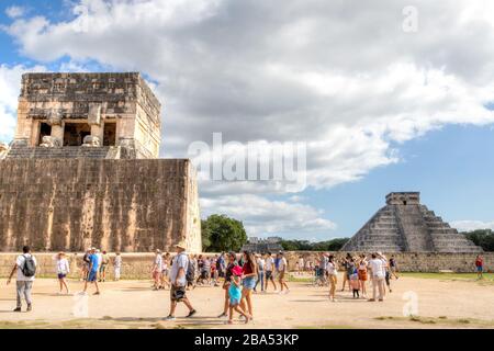Chichen Itza, Mexico - Dec. 23, 2019: Tourists visit the famous Kukulcan pyramid at Chichen Itza in  the Yucatan Peninsula of Mexico. A UNESCO World H Stock Photo