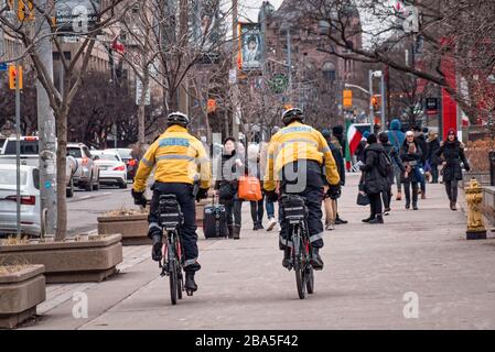 TORONTO, CANADA - 01 04 2020: Toronto Police bicycle patrol officers guarding the University avenue in Downtown Toronto Stock Photo