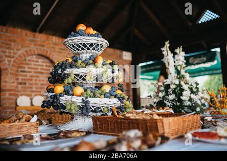 A table full of fresh arranged fruit for a party Stock Photo