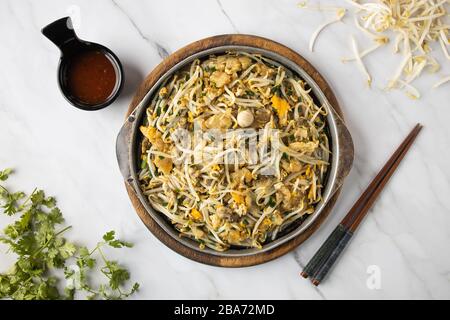 This is the picture of Oysters omelette with hot sauce. Stock Photo