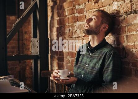 fine writer drinking morning coffee and working Stock Photo