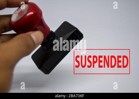 Close up Red Handle Rubber Stamper and text suspended isolated on White Background. Stock Photo