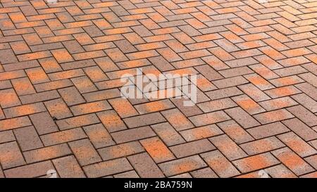Red, gorgeous, rectangular ceramic clinker tile for patio or sidewalk Stock Photo