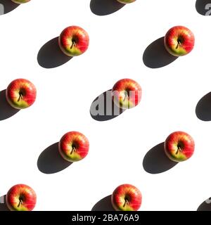 Seamless apples pattern. Creative food on white background. Fresh season fruit texture with strong shadows Stock Photo
