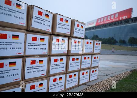 (200326) -- BEIJING, March 26, 2020 (Xinhua) -- Boxes containing 50,000 medical masks donated by Sany Group to Germany is seen before shipment at its industrial park in Changsha city, central China's Hunan province, March 14, 2020. TO GO WITH: Spotlight: As China recovers from COVID-19 blow, Chinese rush to Europe's rescue. (Xinhua) Stock Photo