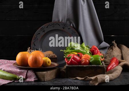 Oranges and bell peppers in different trays. Stock Photo