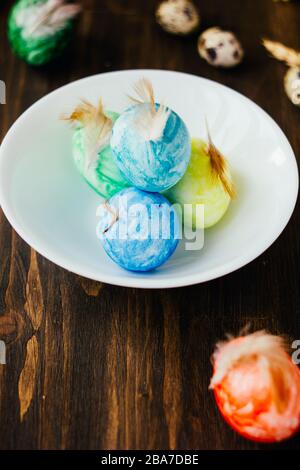 Red color egg standing near ceramic bowl of easter eggs Stock Photo - Alamy