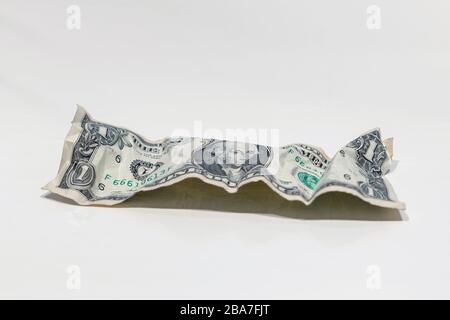 Crumpled one dollar bills isolated on white background. USD cash money. Stock Photo