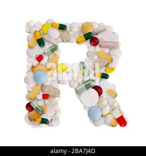 Capital letter R made of various colorful pills, capsules and tablets on isolated white background Stock Photo